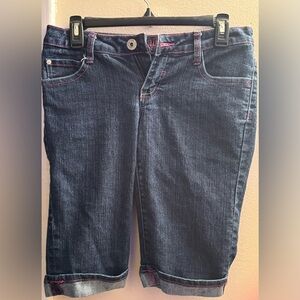 Blue jeans with pink hem and has initials SP on the back for SouthPole